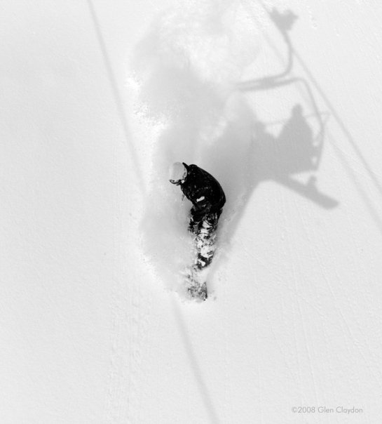 Snowboarding through powder in niseko